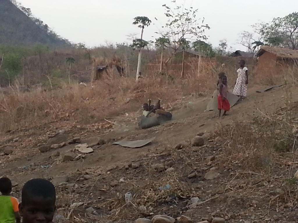 Children sledding on environmental protection liners, removed (unwittingly) from key mine areas.